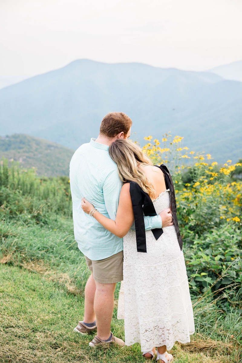 James and Hannah Brooke embracing overlooking the Blue Ridge Mountains